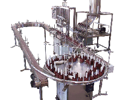 Servo Driven Straight Line Piston Liquid Filler by Packaging Dynamics, Ltd. - Manufacturer of Automatic & Semi-Automatic Liquid fillers, Conveyors, Unscramblers, Accumulators, and Custom Designed Packaging machinery & nozzles for liquids.